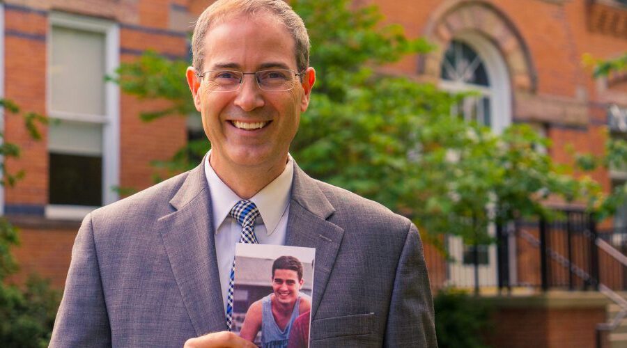 Dean Long with a photo of himself